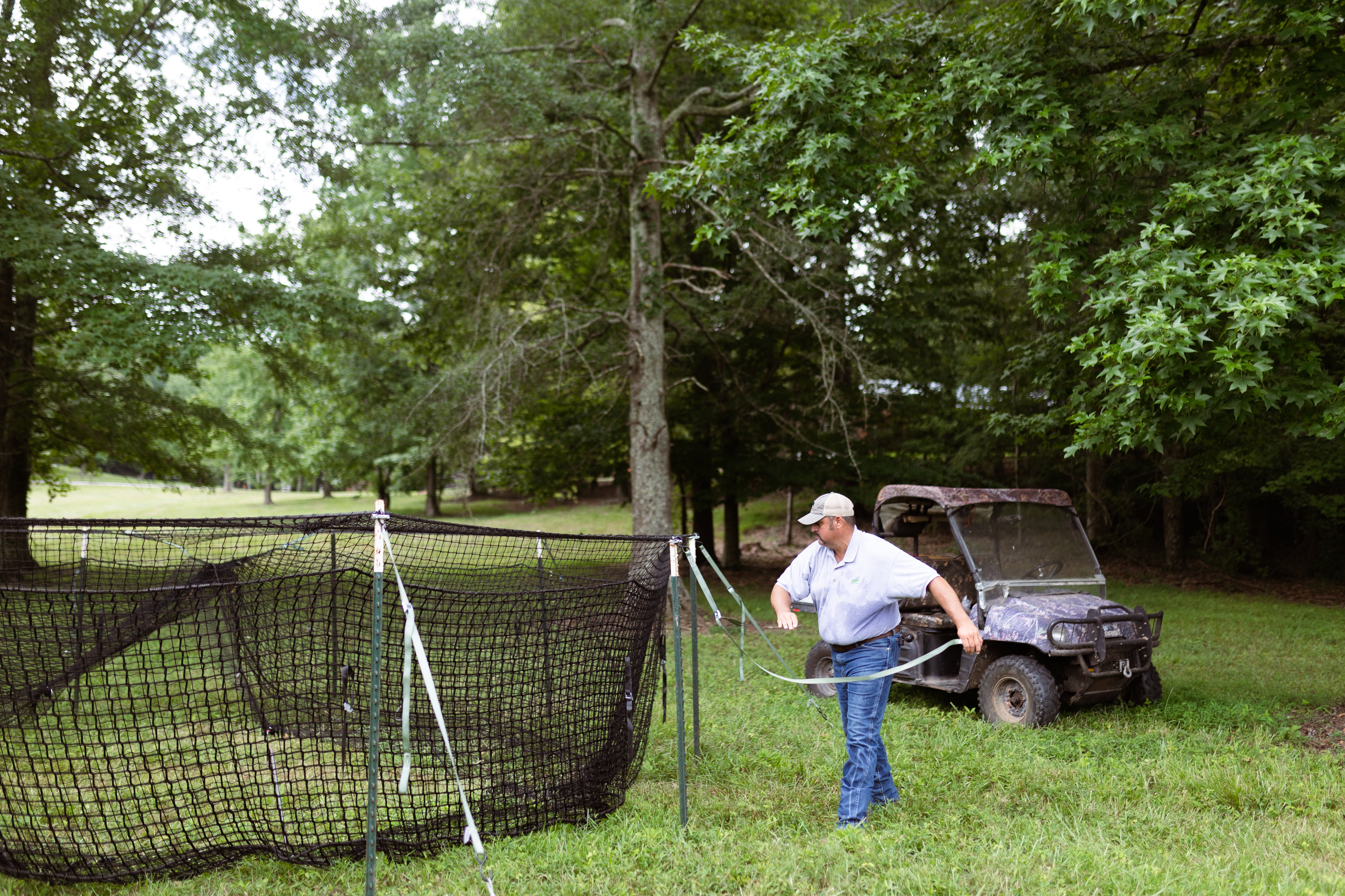 Man setting up Pig Brig Trap System