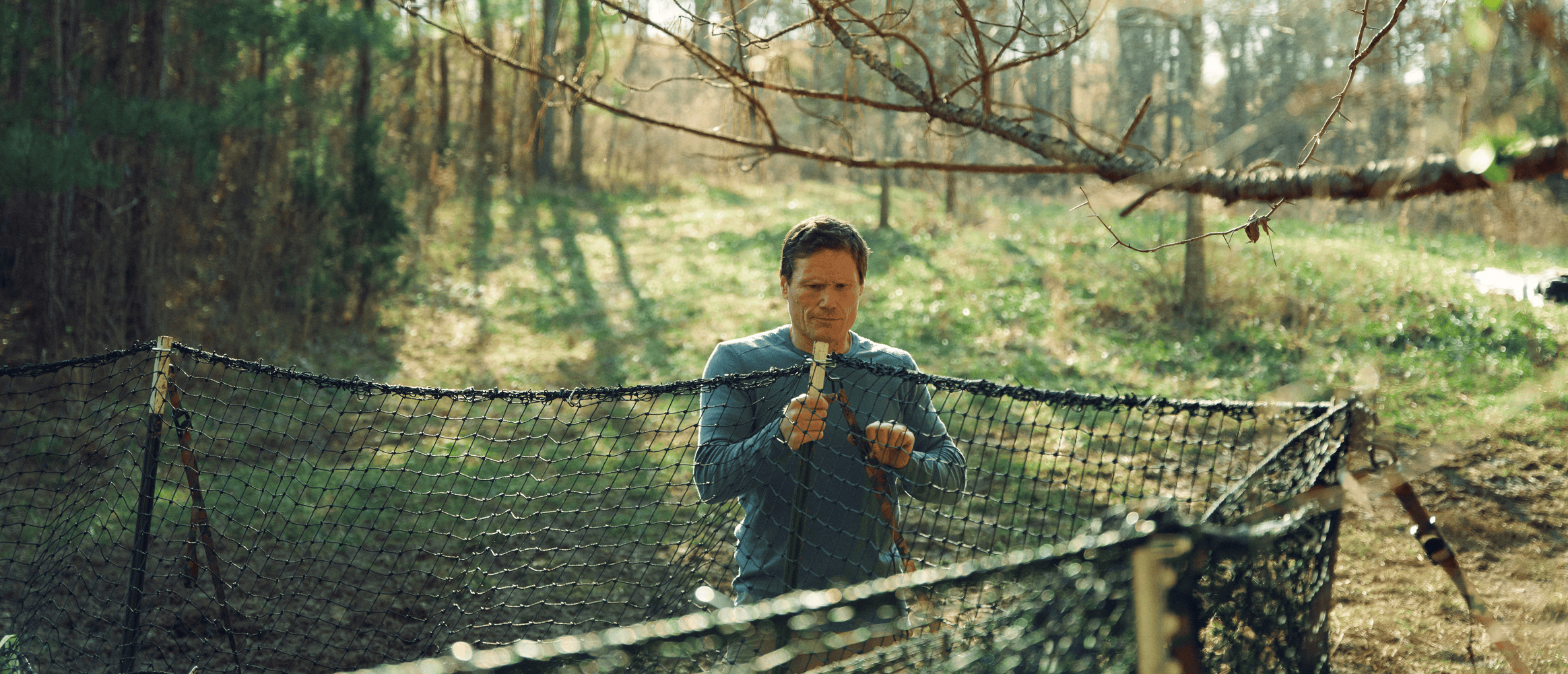 Man setting Pig Brig wild boar trap system