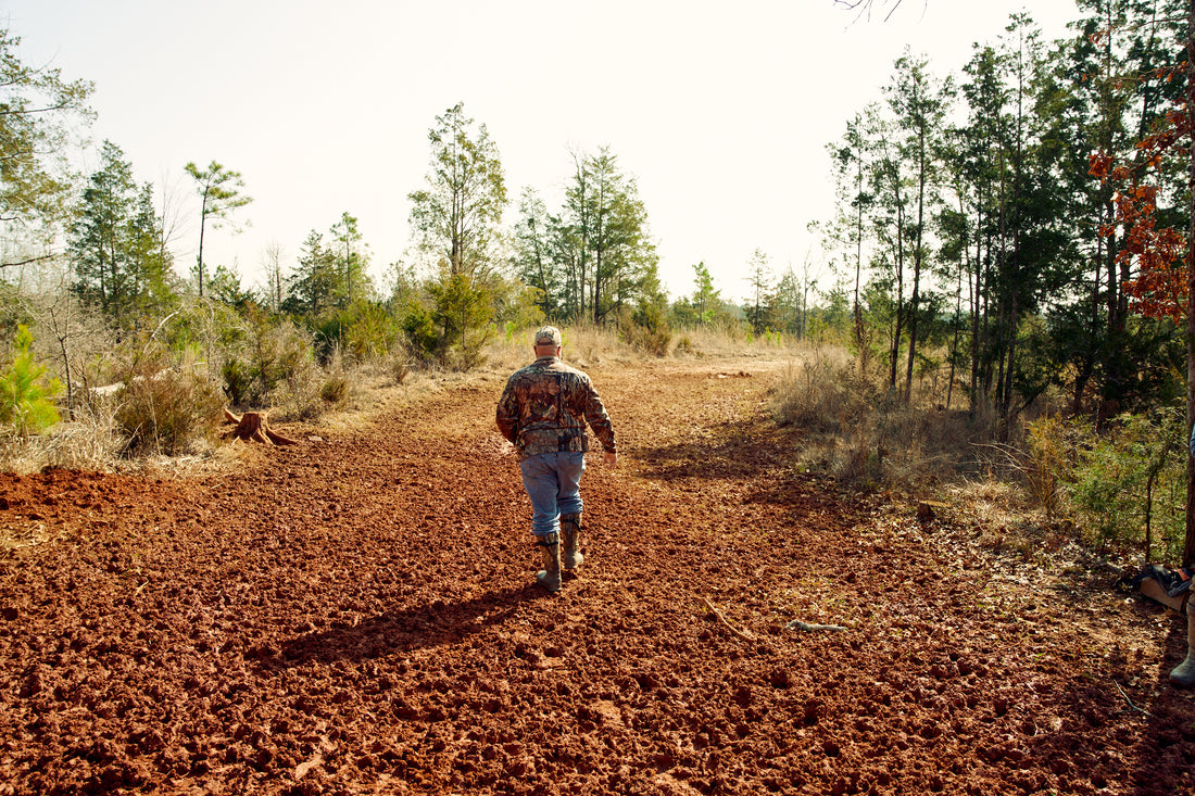 Man walking through clearing