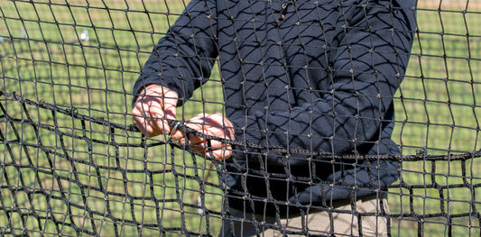 Man fixing Pig Brig trap net