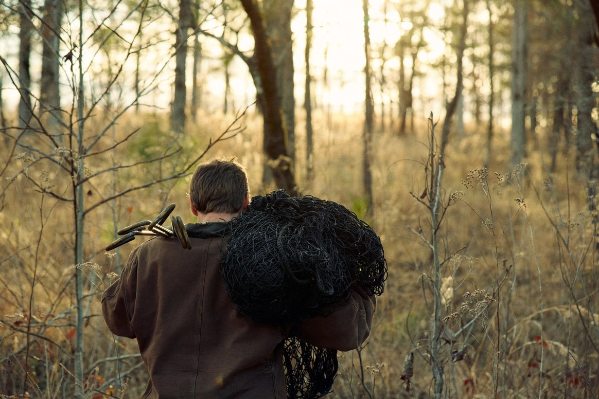 person carrying trap 