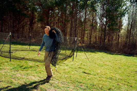 Man carrying pig brig trap net