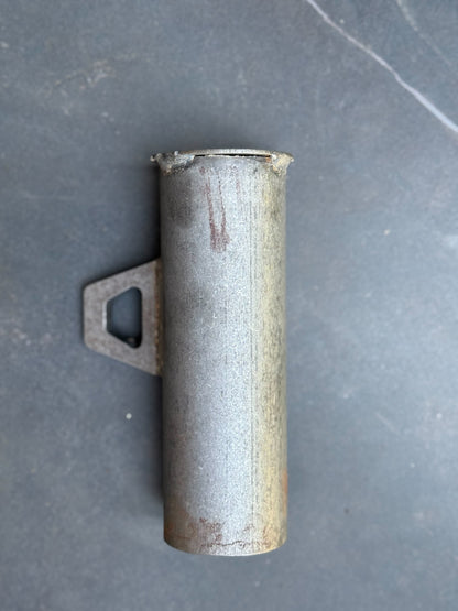 Metal exhaust pipe on a gray surface